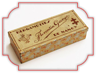 Confiserie Florentin Fer blanc recouvert de papier vers 1910 17 x 6,5 x 4 cm.